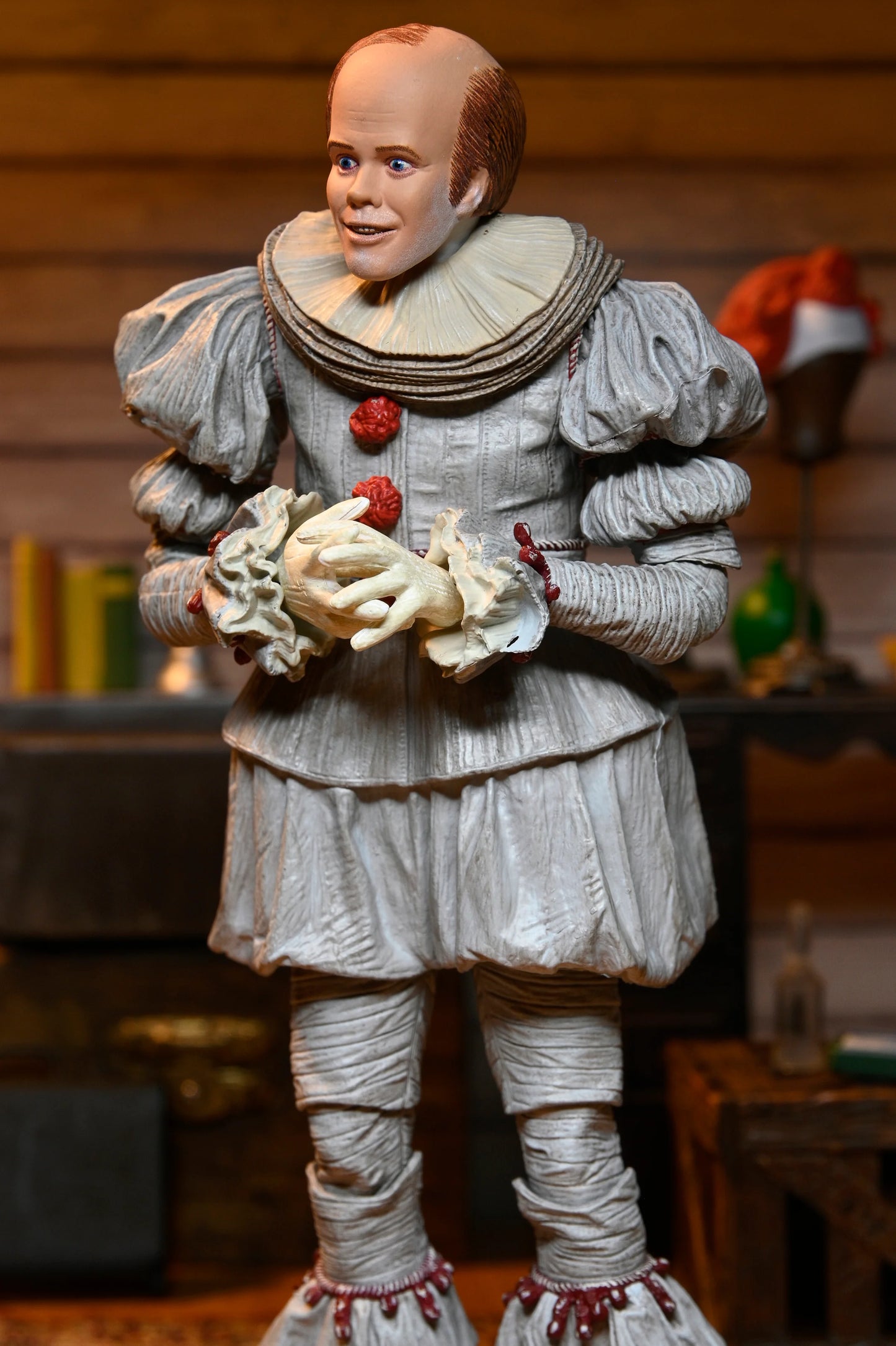 IT: Welcome to Derry - Ultimate Bob Gray as Pennywise 7" Scale Action Figure (PRE-ORDER)