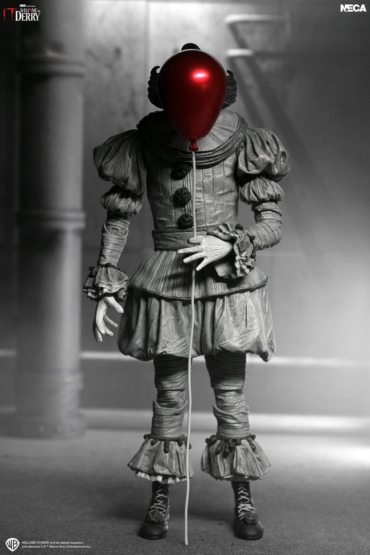 IT: Welcome to Derry - Ultimate Black & White Pennywise 7” Scale Action Figure (PRE-ORDER)